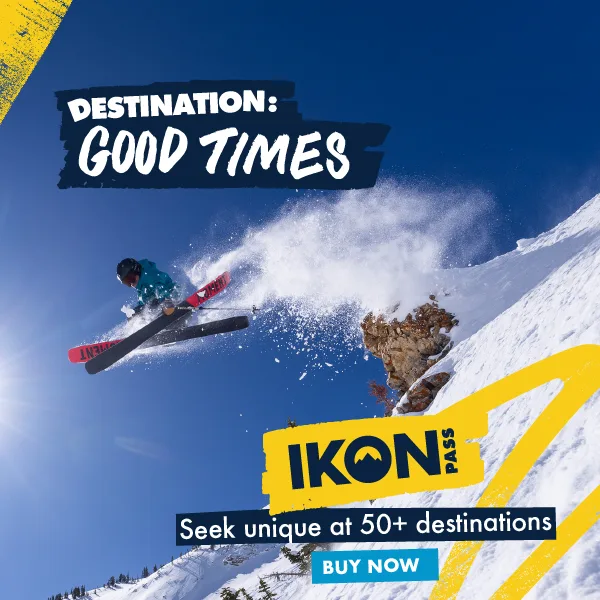 Ikon Pass met een skier onder een blauwe lucht en zonneschijn